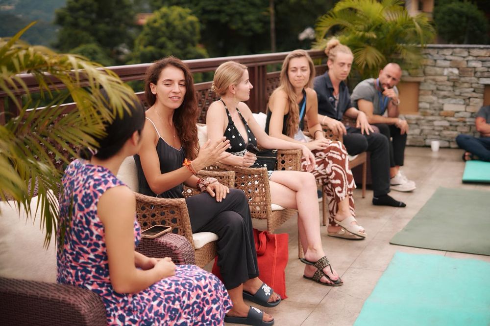 Guests talking on a rooftop terrace