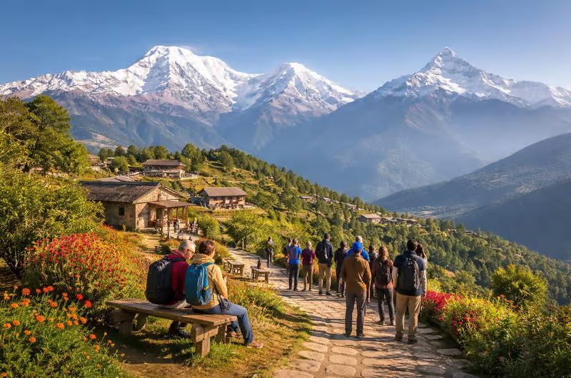 Hikers on a stone trail with the Annapurna range behind
